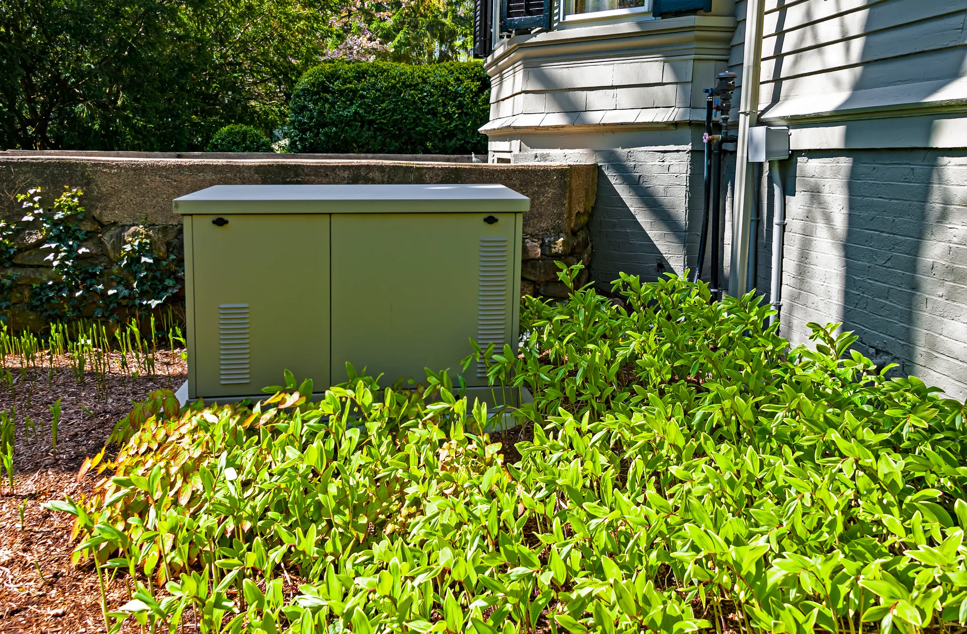 Professional residential backup generator installation in North Dakota showing modern standby generator unit next to home